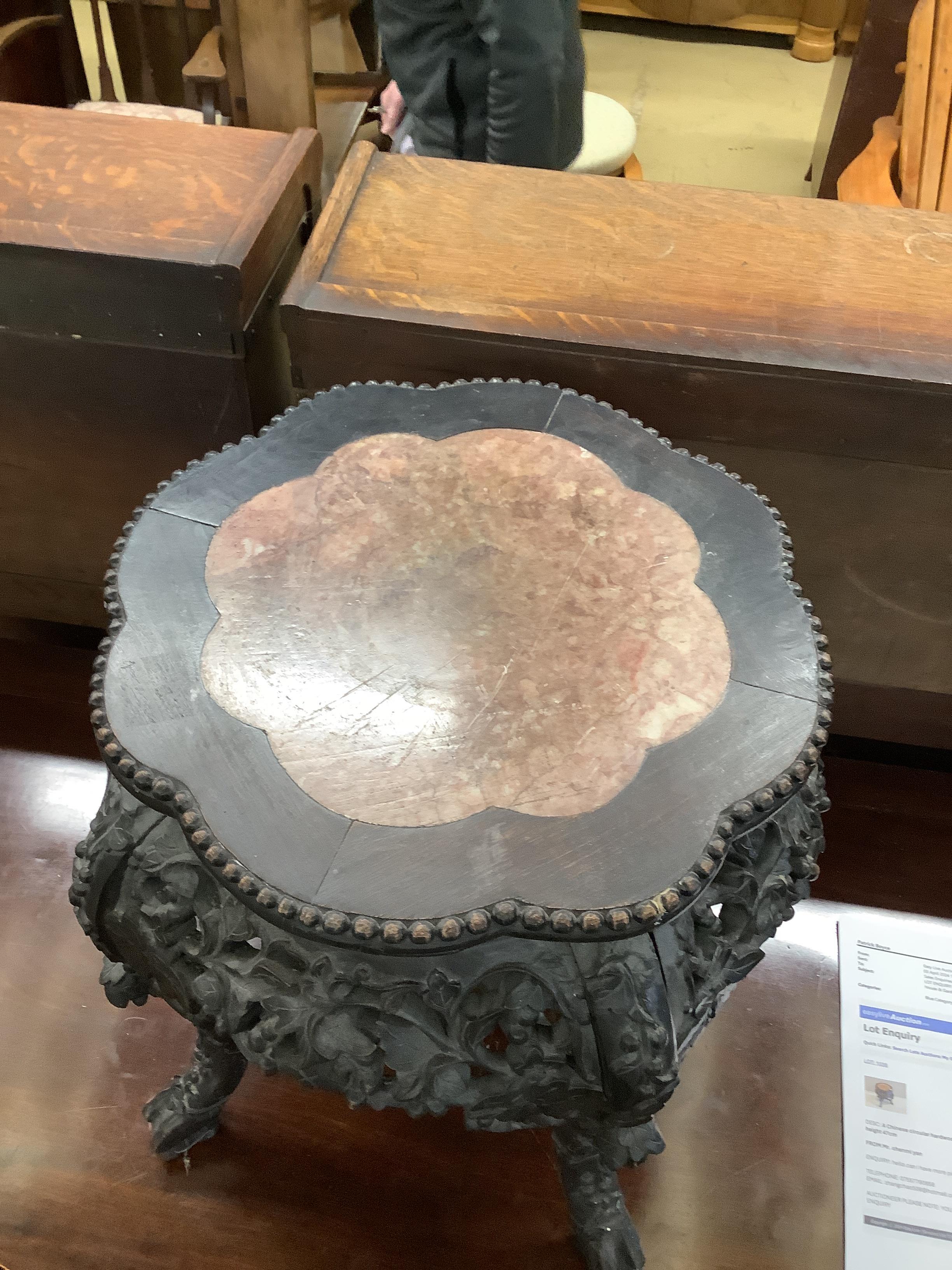 A Chinese circular hardwood rouge marble topped jardiniere stand, diameter 42cm, height 47cm